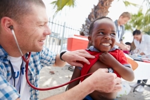 Doctor giving checkups to underprivileged kids